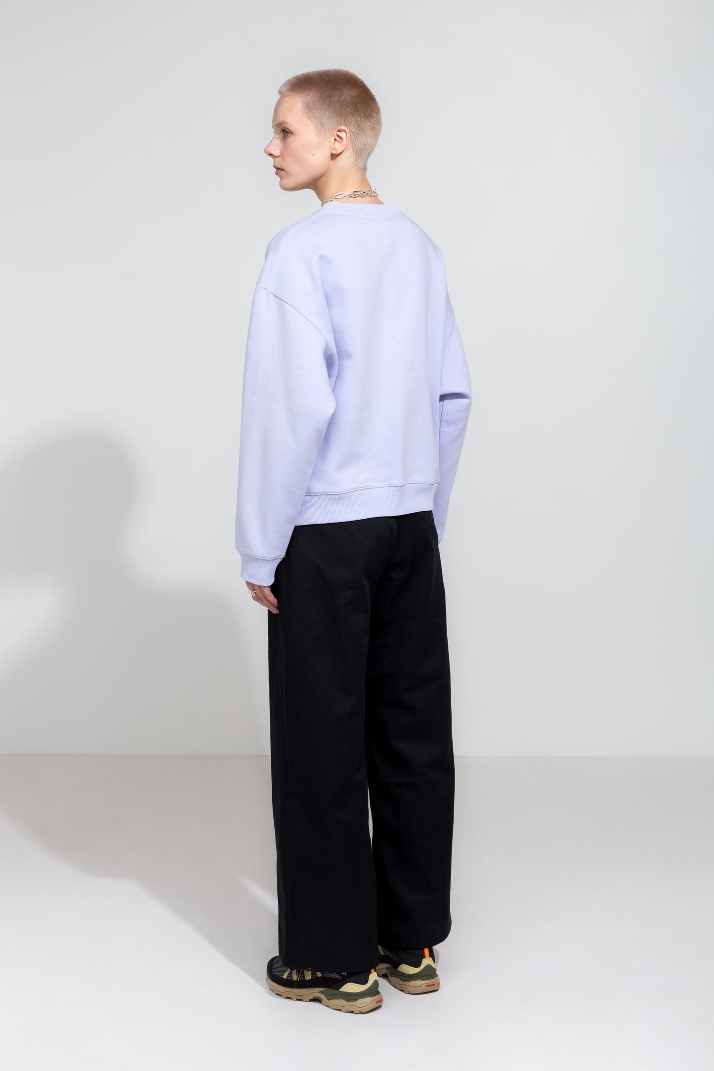 Icy lilac oversize sweatshirt and black workwear trousers