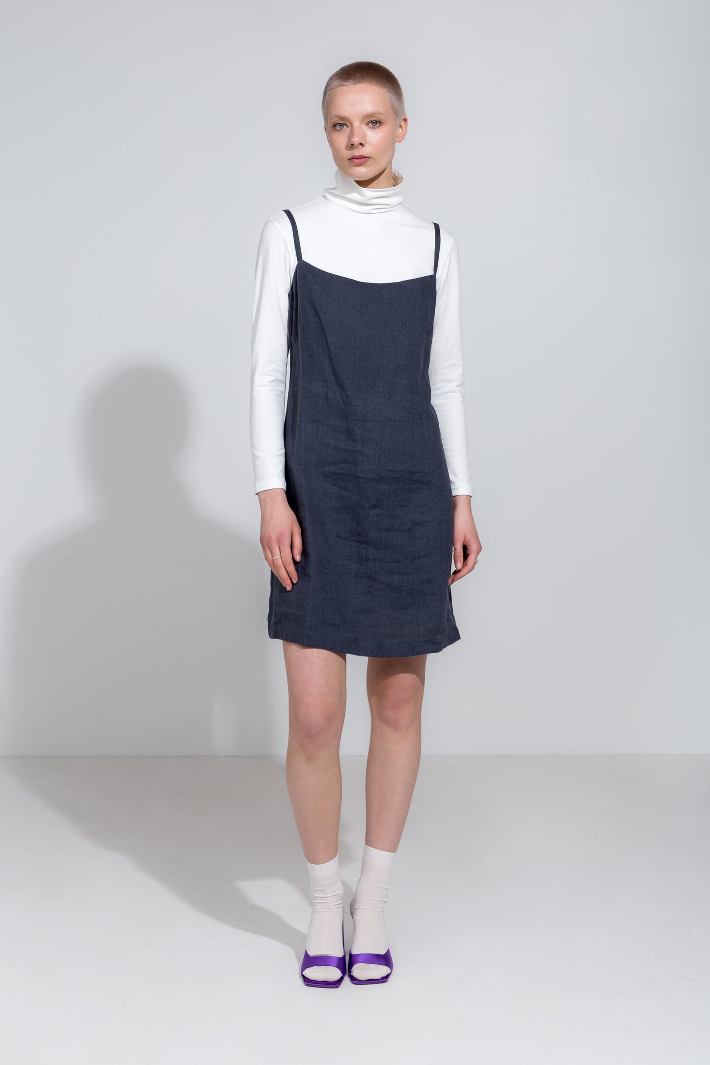 Dark grey linen strap dress and white organic roll neck