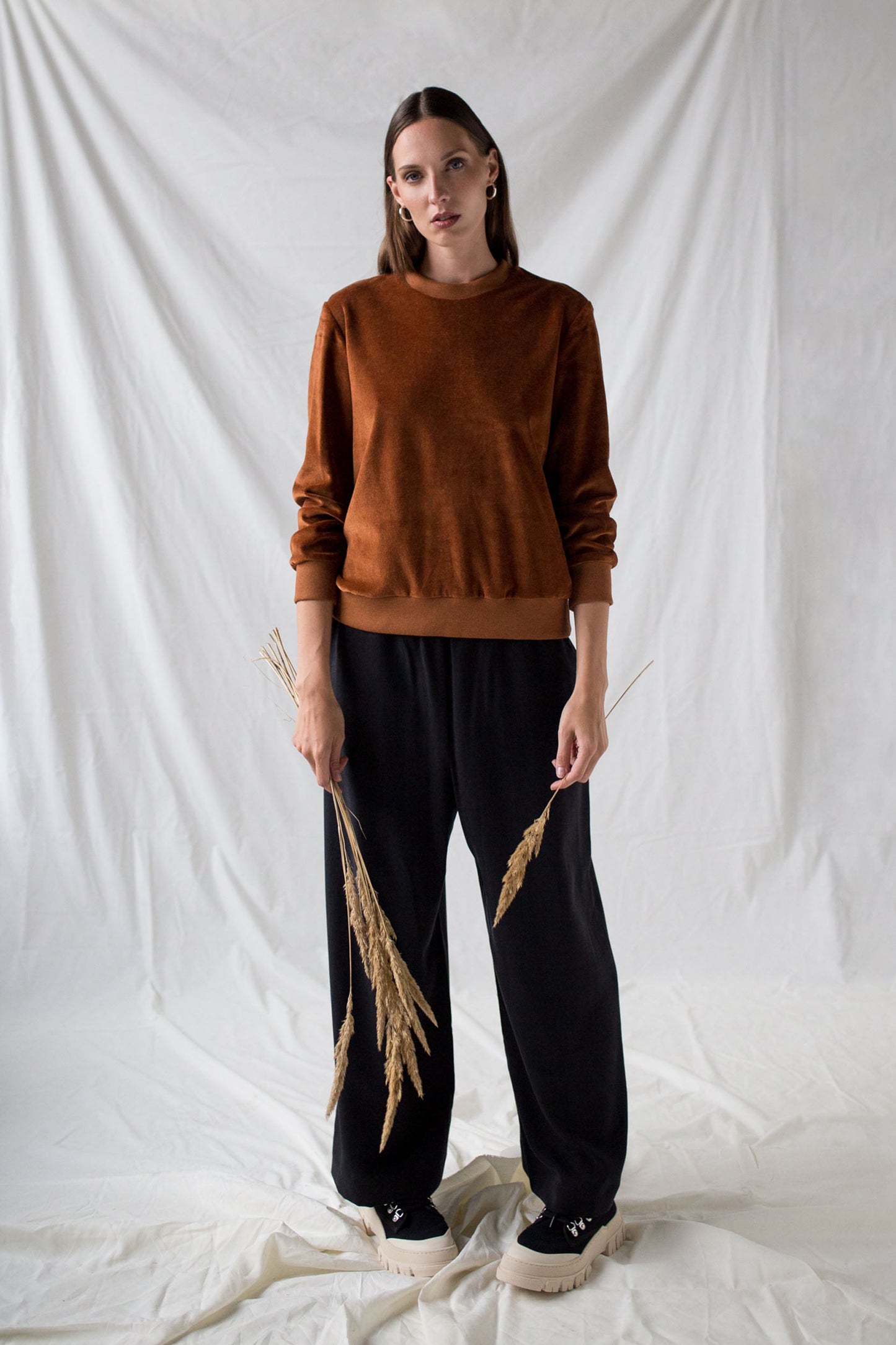 Rust brown organic velour sweatshirt and loose tencel trousers