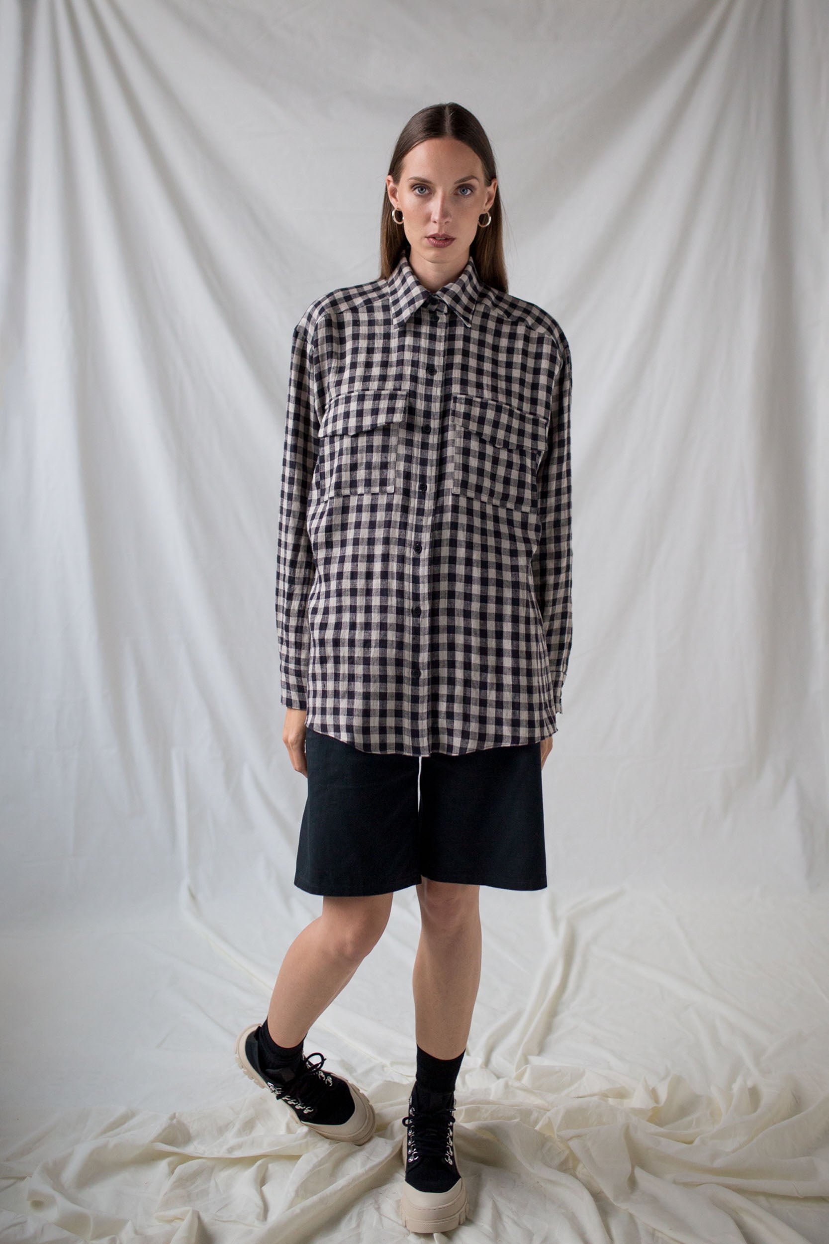 Black twill shorts and checkered linen shirt