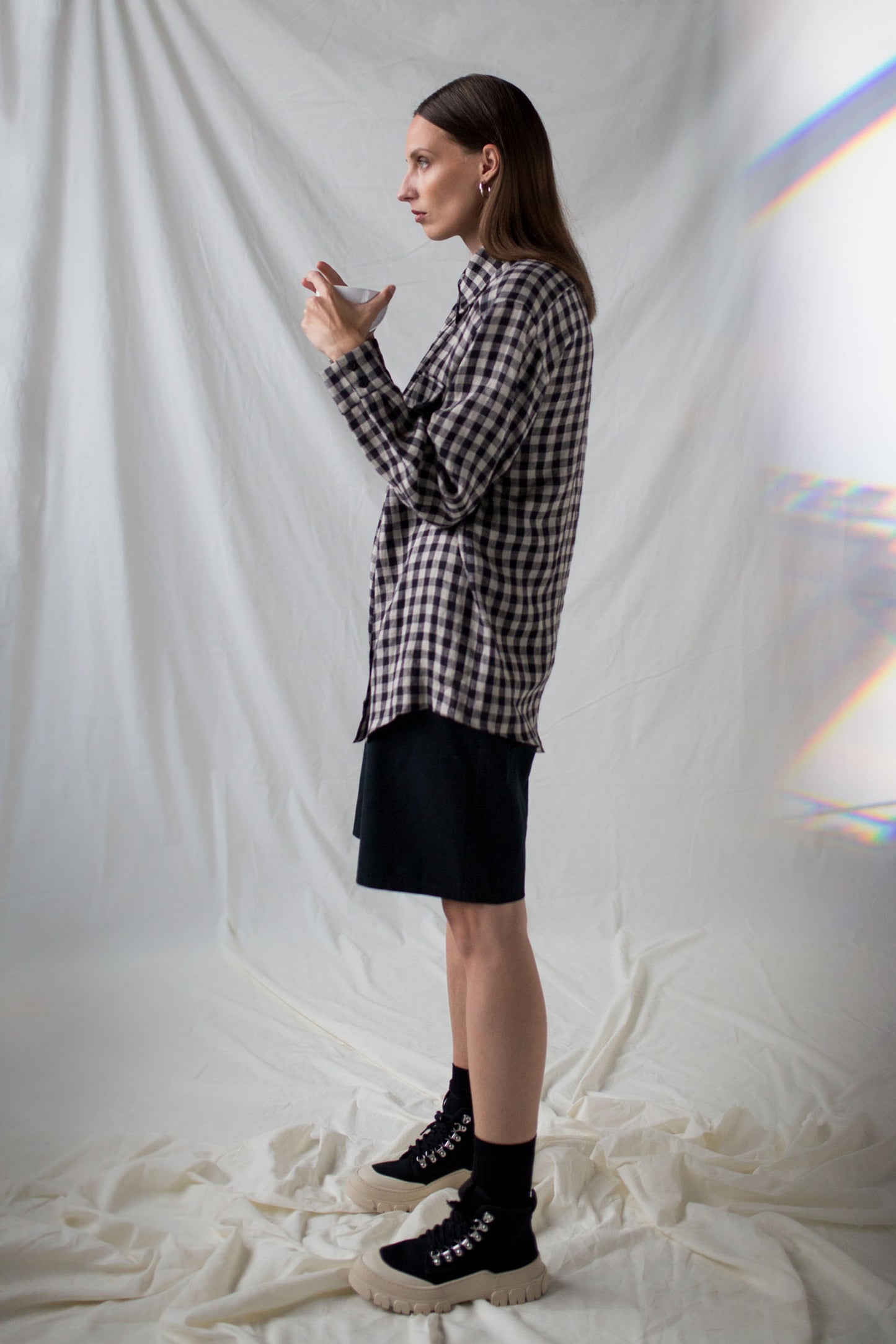 Black twill shorts and checkered linen shirt