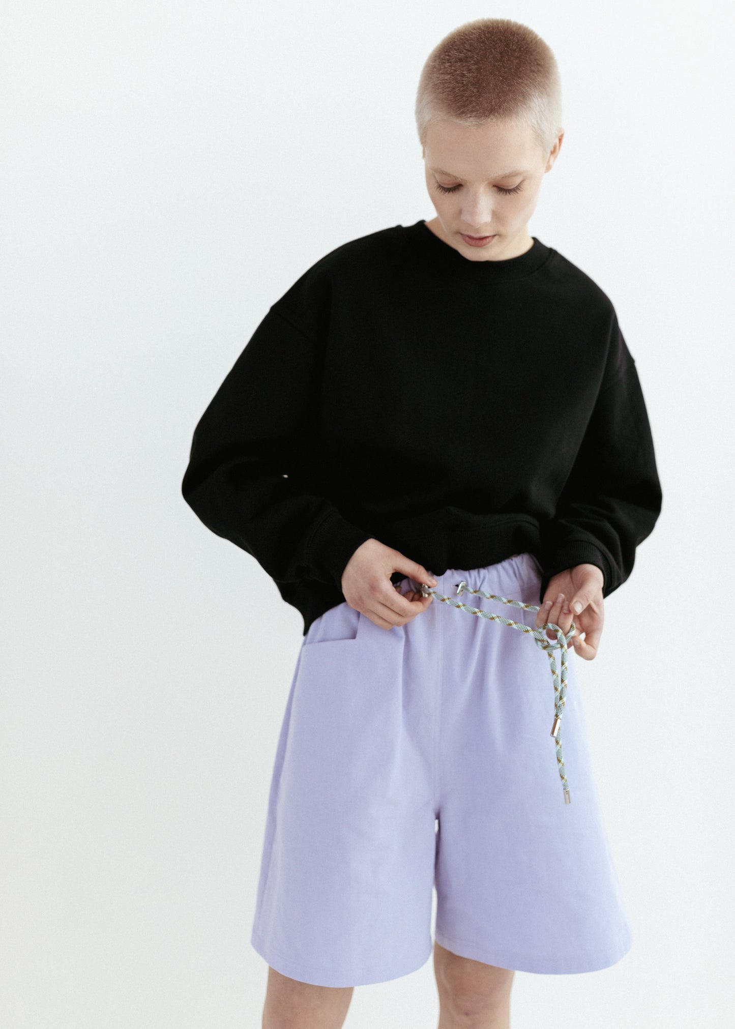 Lilac relaxed fit twill shorts and black organic sweatshirt