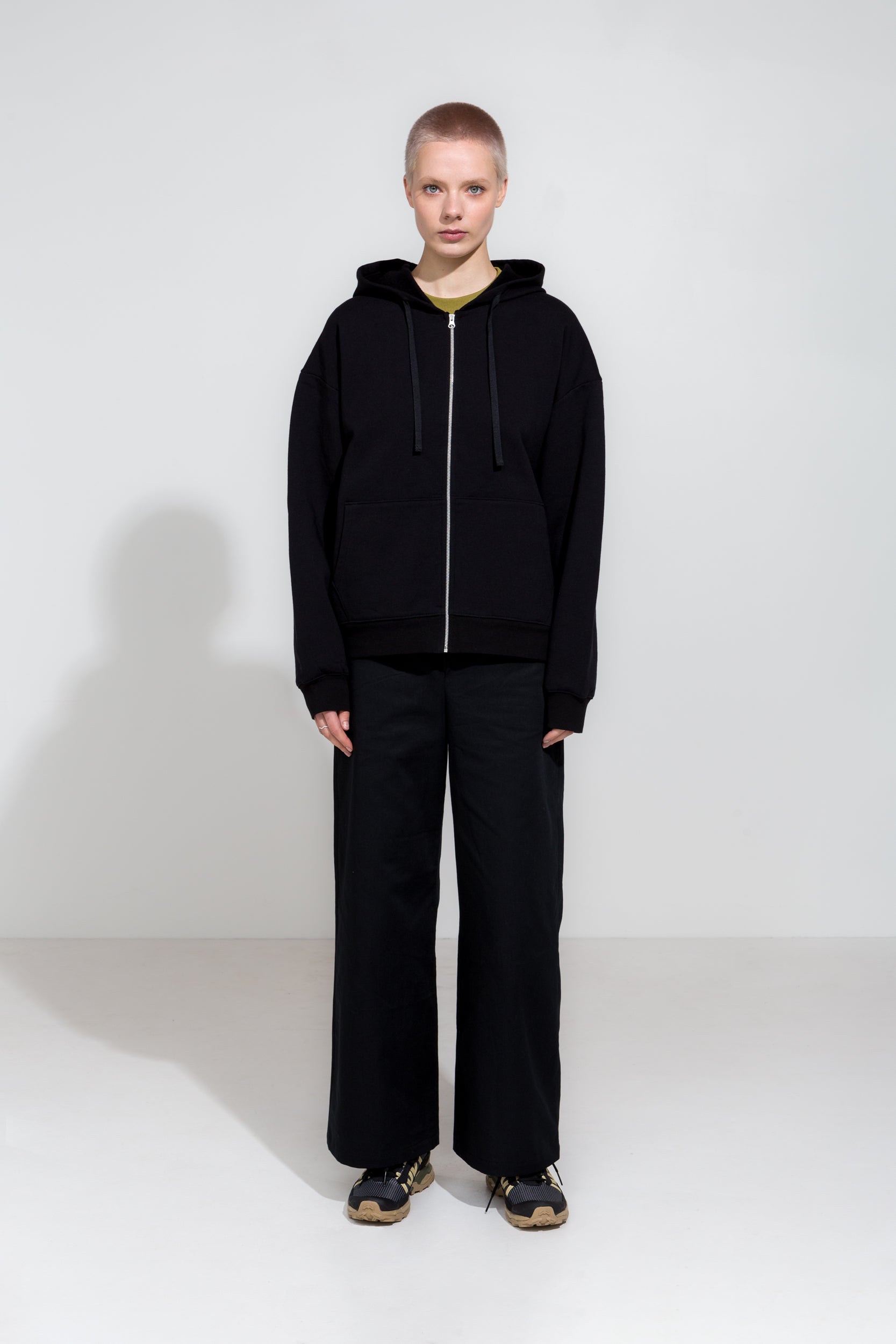 Black straight cut twill trousers and organic cotton hoodie jacket