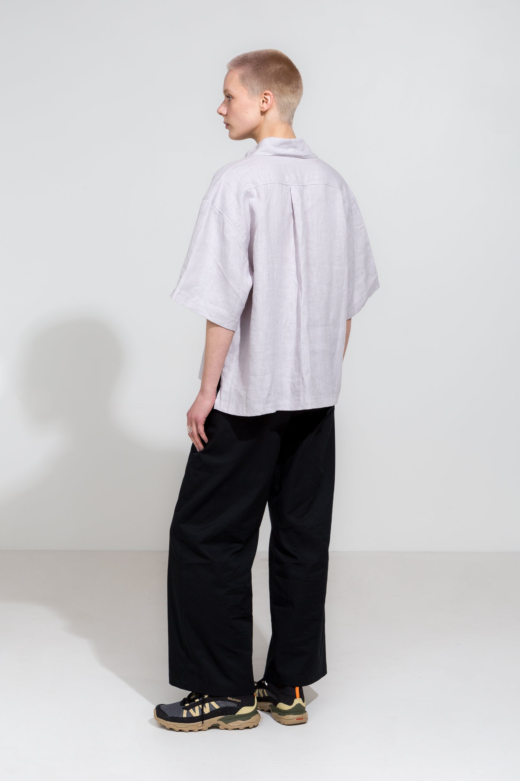 Relaxed short sleeve shirt in beige linen and black workwear pants in organic cotton