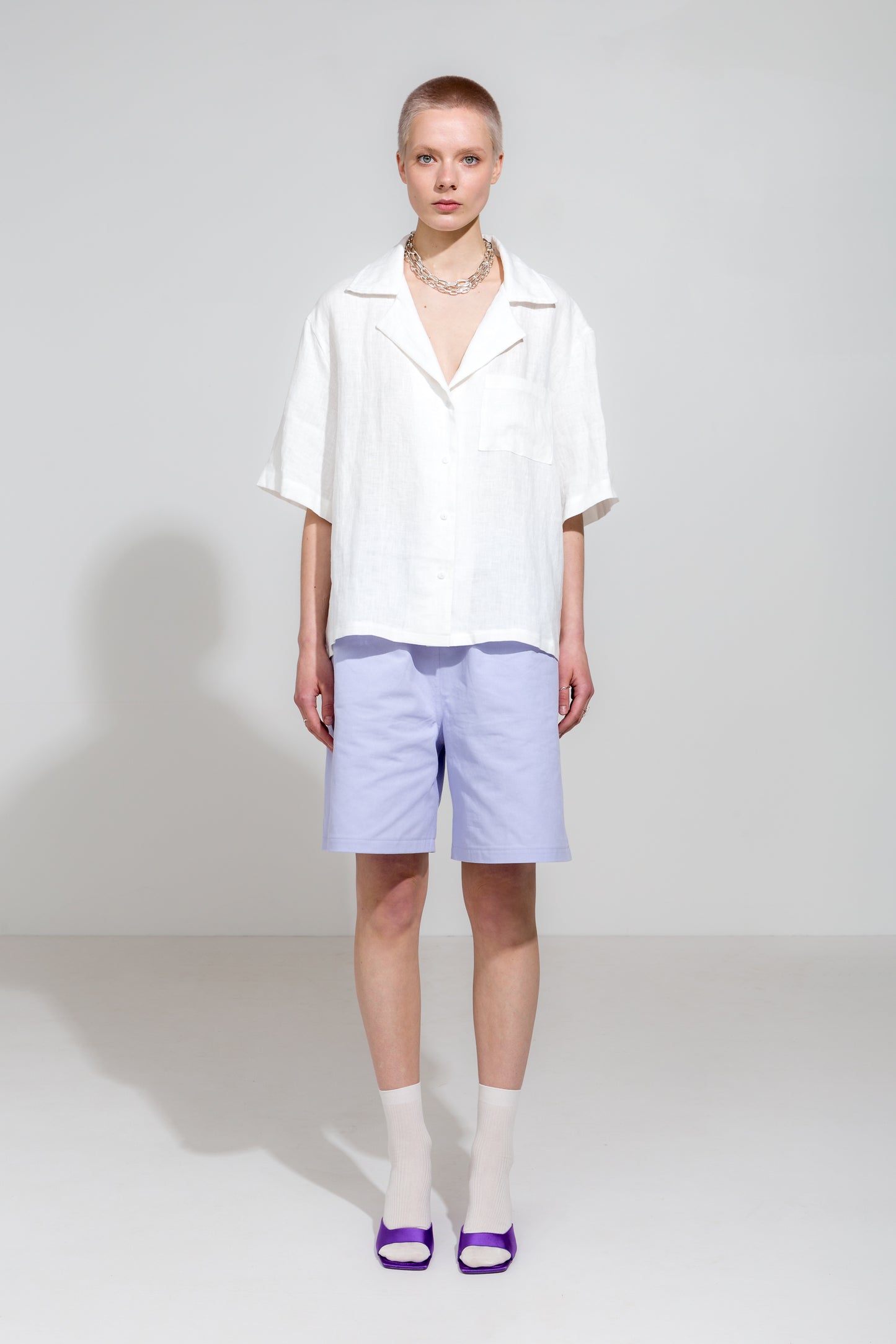 Open collar short sleeve shirt in white linen and lilac workwear shorts