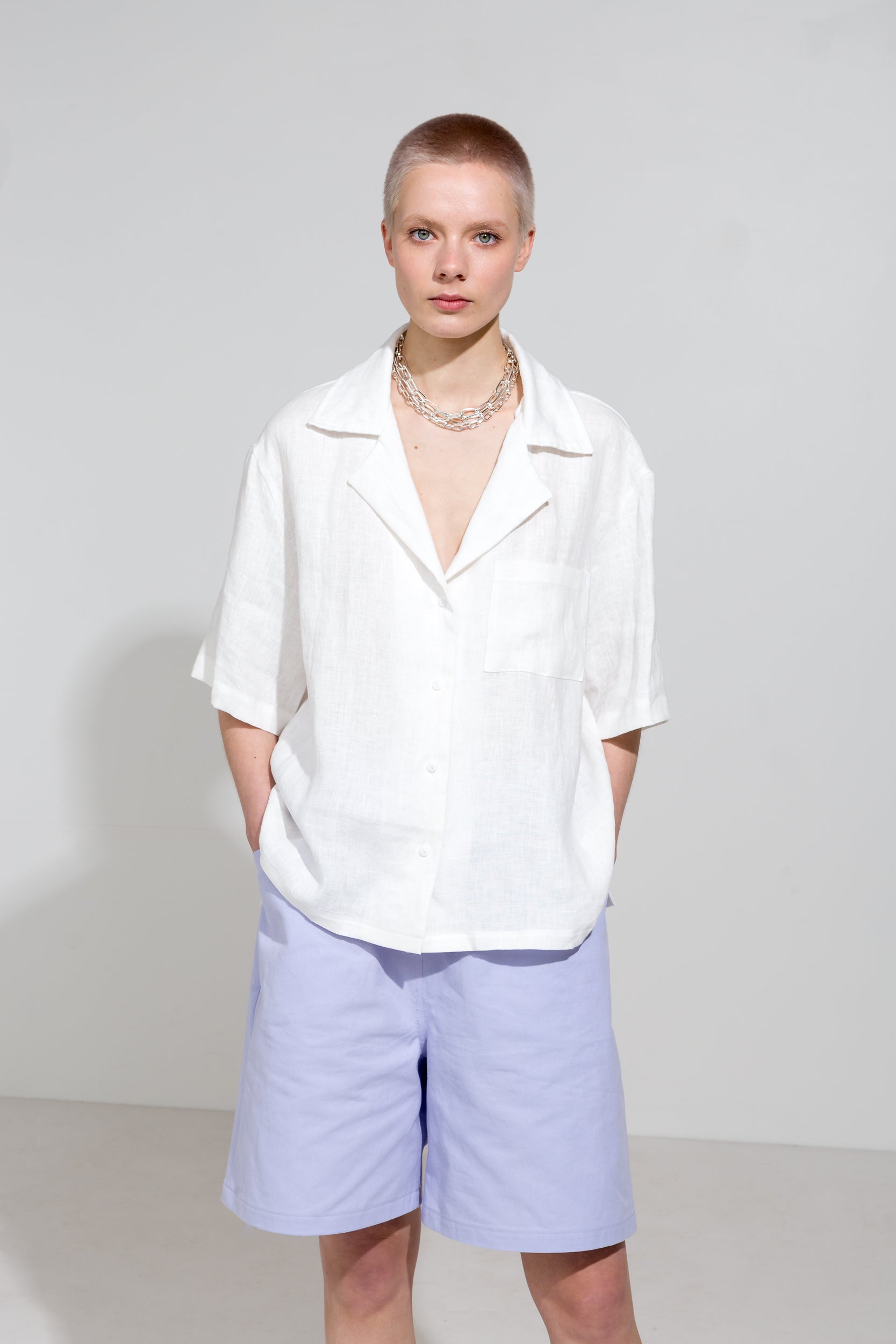 Relaxed fit twill shorts and white linen shirt with open collar