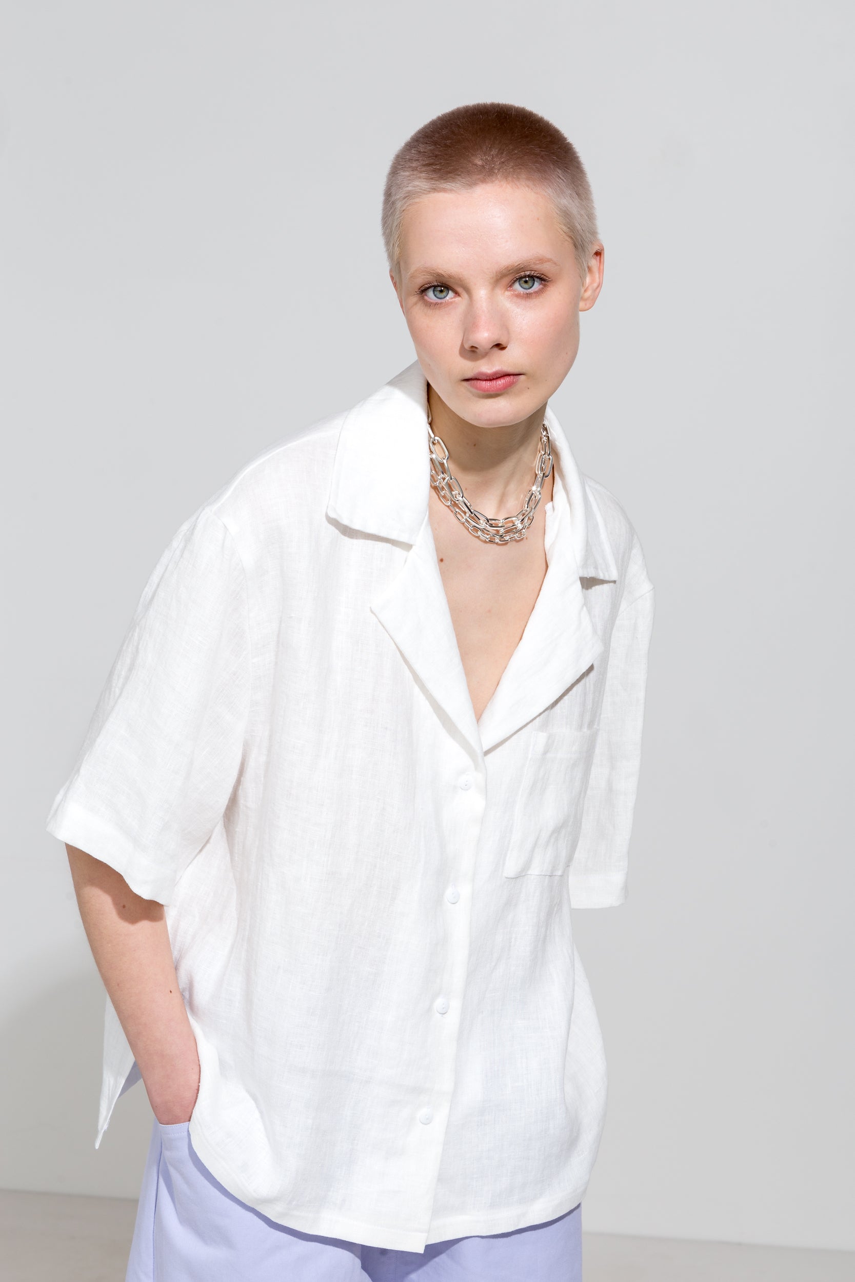 Open collar short sleeve shirt in white linen